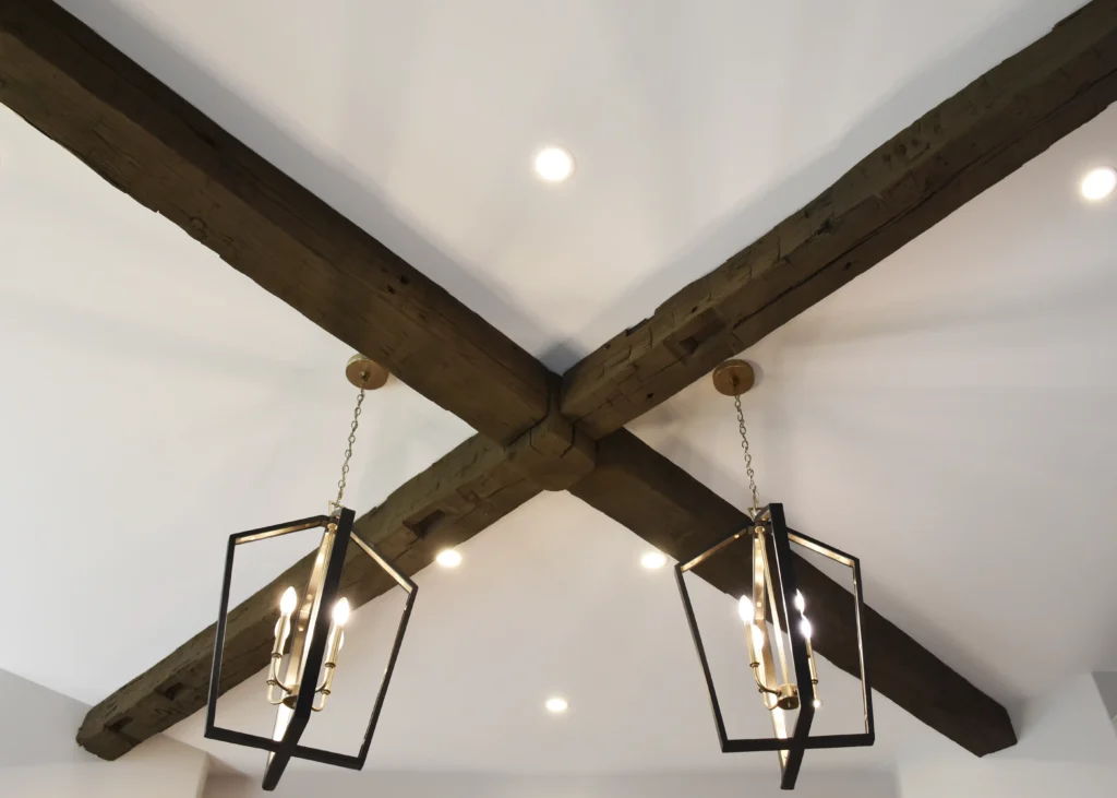 Salvaged beams from the old house, now are used as decorative touches in the new home.