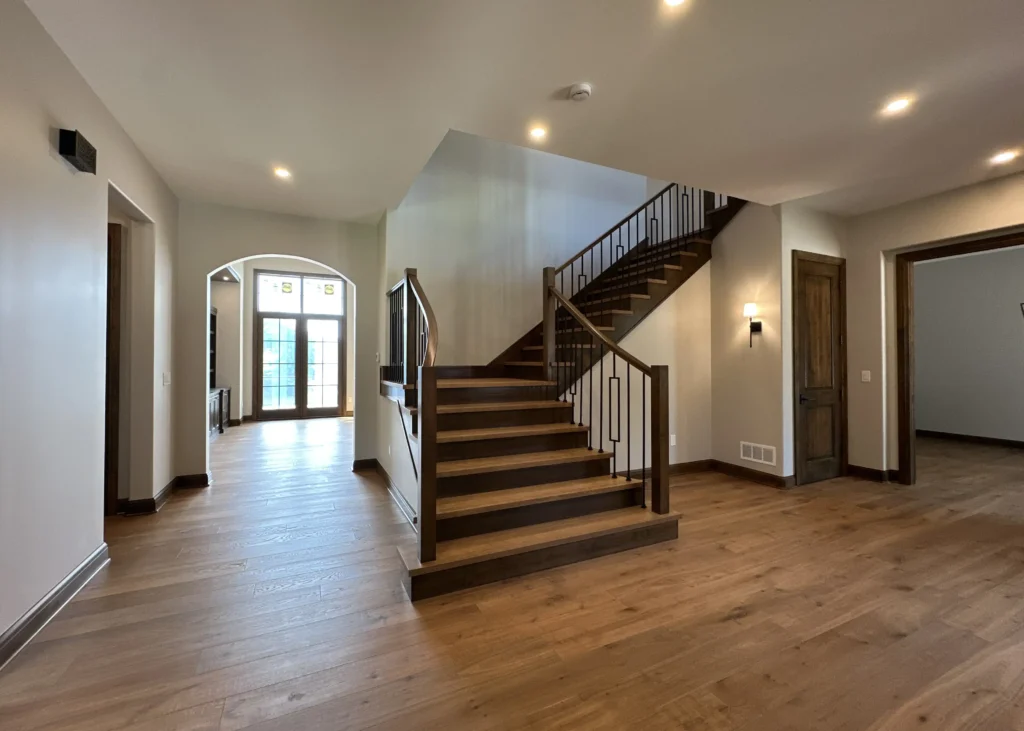 Incredible woodworking is showcased in a grand staircase.