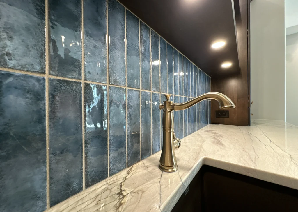 High-end tile work and finishes on a bar sink